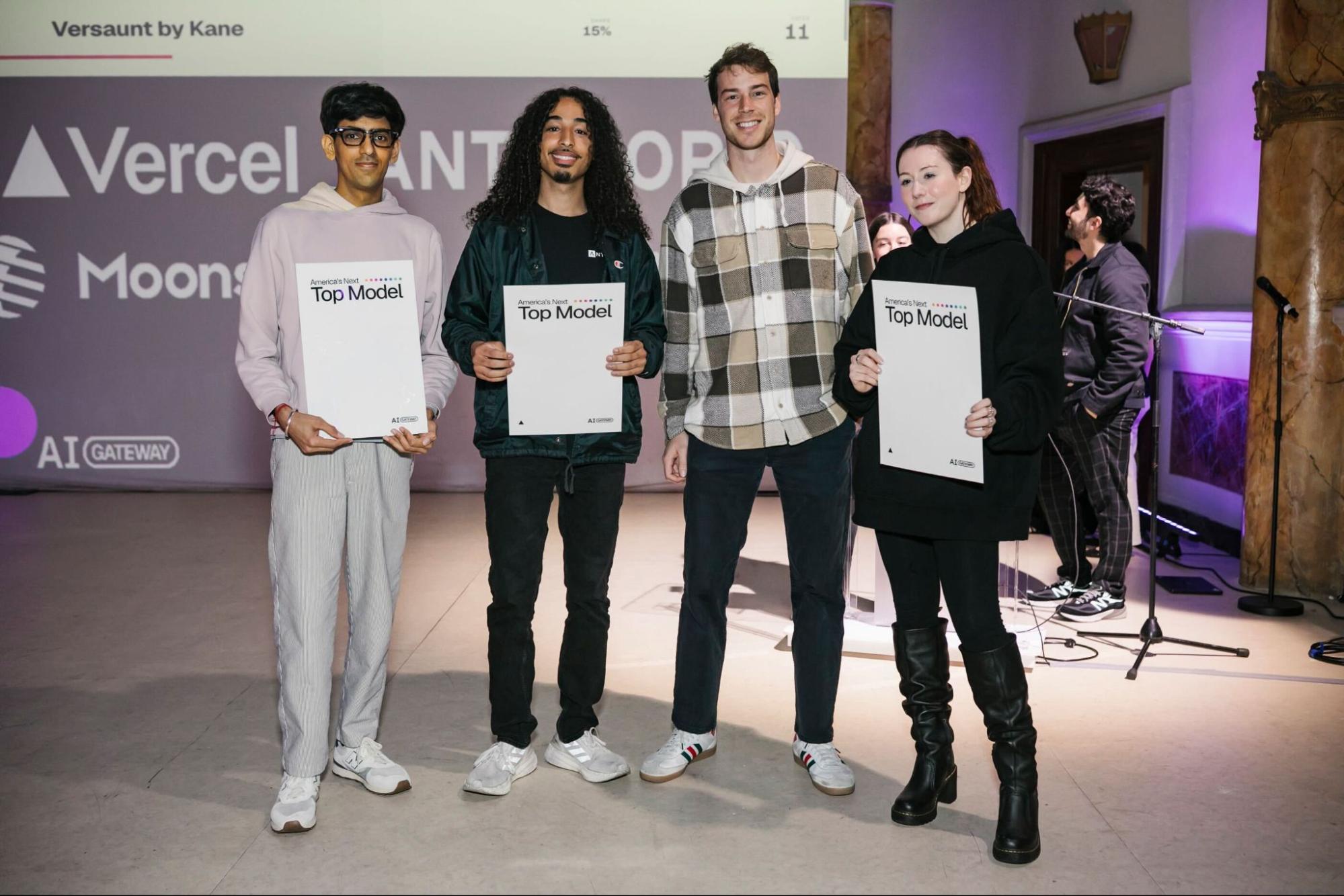 Photo of Kathryn with other hackathon participants on stage